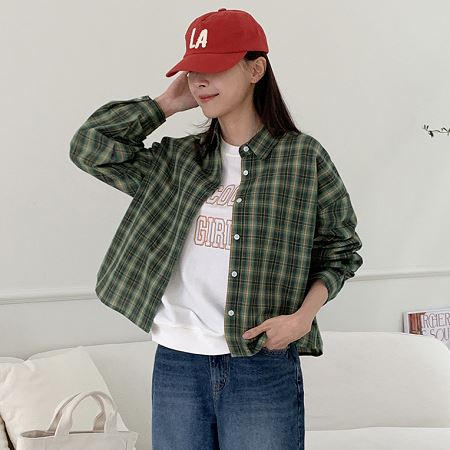 A selection of Dongdaemum Women’s Shirts & Tops, showcasing the best of Korean fashion.