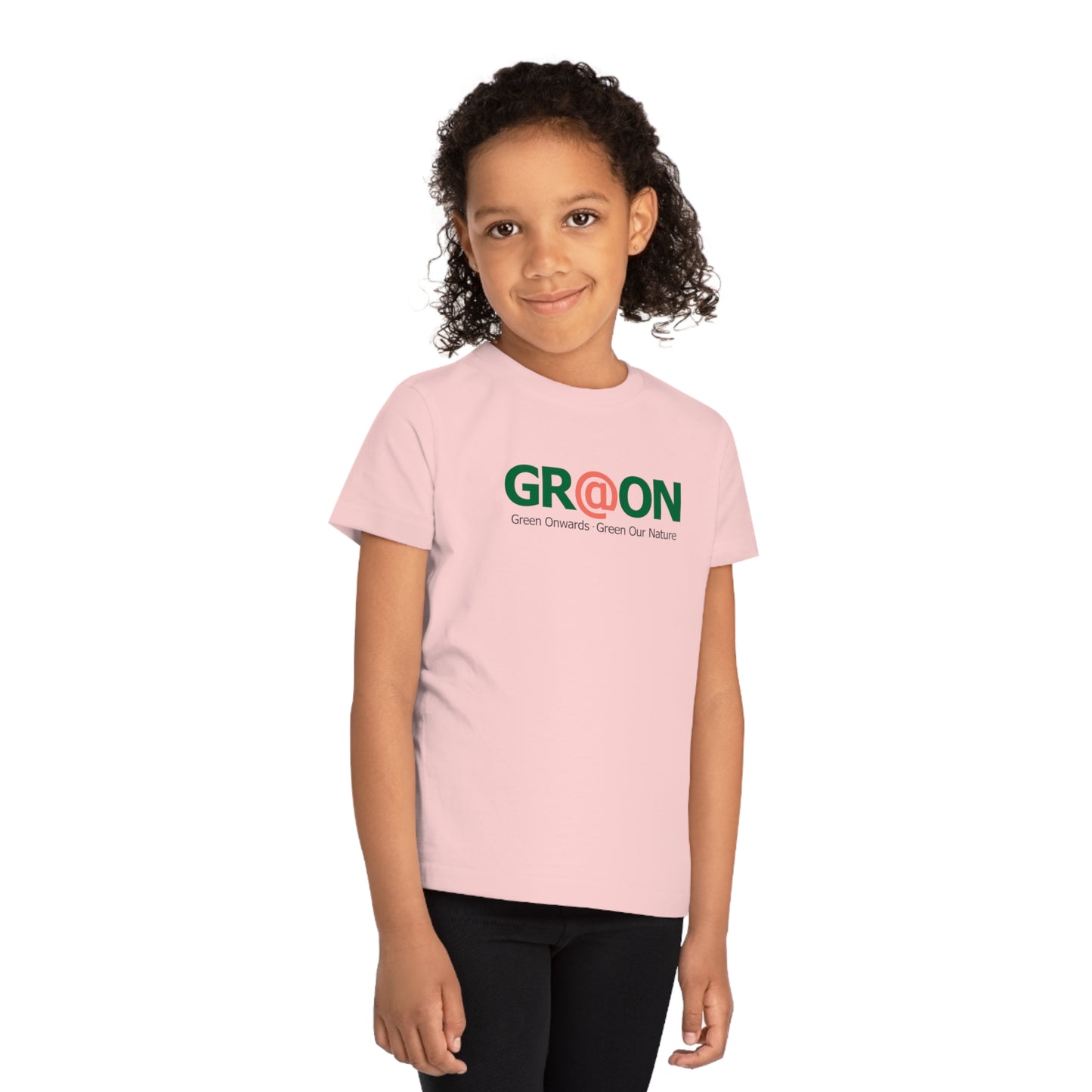 Child wearing a GR@ON Kids T-Shirt made from organic cotton, featuring a fun and colorful design. GR@ON Kids T-Shirts: Sustainable style, fun designs.