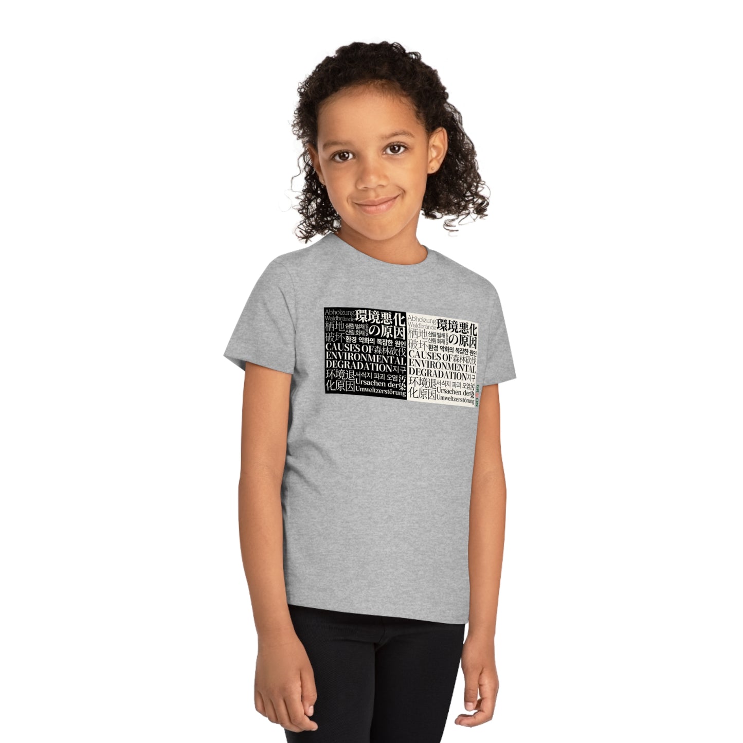 Child wearing a GR@ON Kids T-Shirt made from organic cotton, featuring a fun and colorful design. GR@ON Kids T-Shirts: Sustainable style, fun designs.