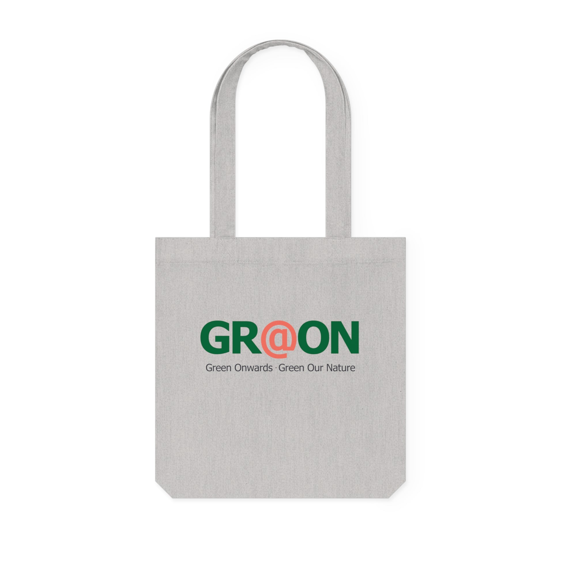 Person carrying a GR@ON Tote Bag made from organic cotton, filled with everyday essentials. GR@ON Tote Bags: Sustainable style, everyday essentials.