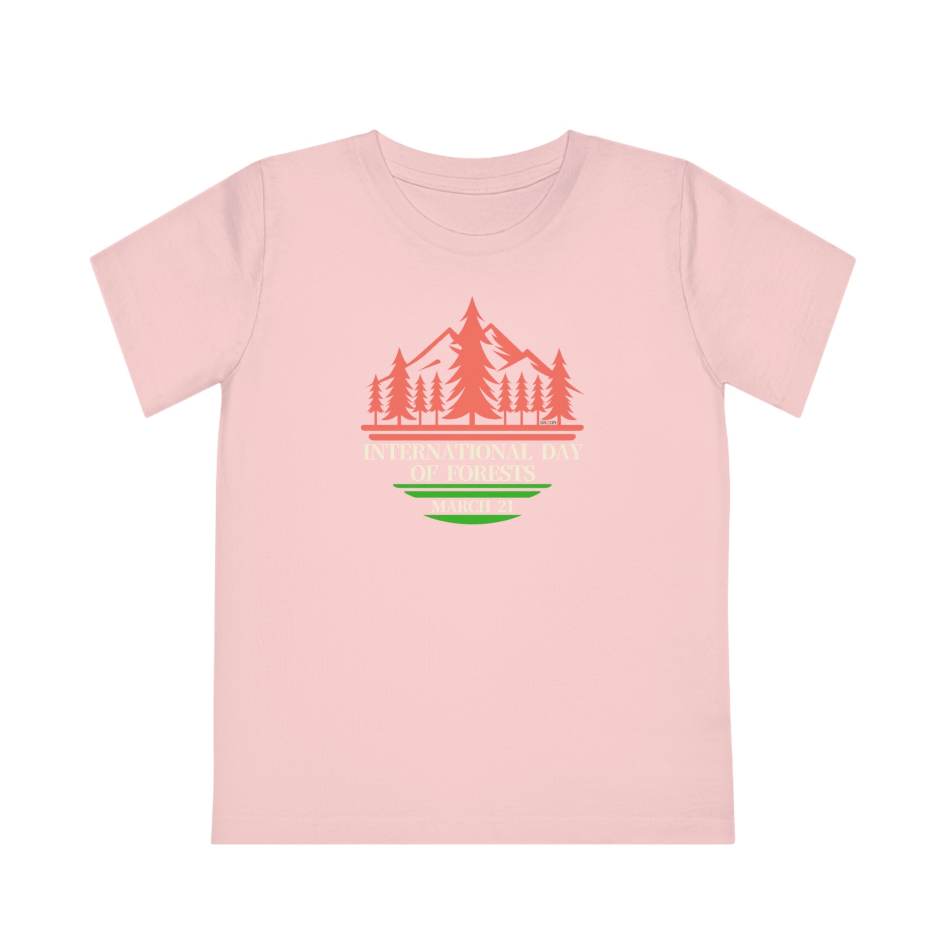 International Day of Forests, Child wearing a GR@ON Kids T-Shirt made from organic cotton, featuring a fun and colorful design. GR@ON Kids T-Shirts: Sustainable style, fun designs.