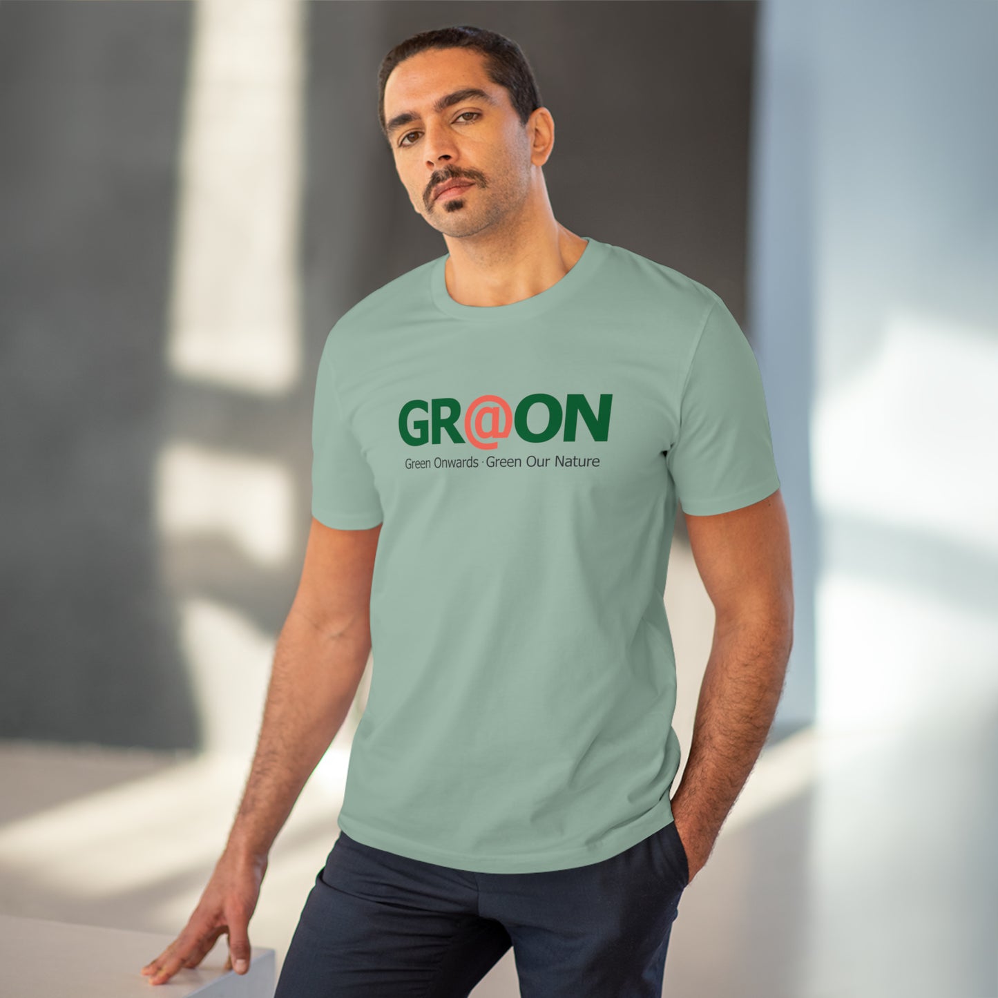 Model wearing a GR@ON T-Shirt made from organic cotton, featuring a stylish and sustainable design. GR@ON T-Shirts: Sustainable style, everyday comfort.