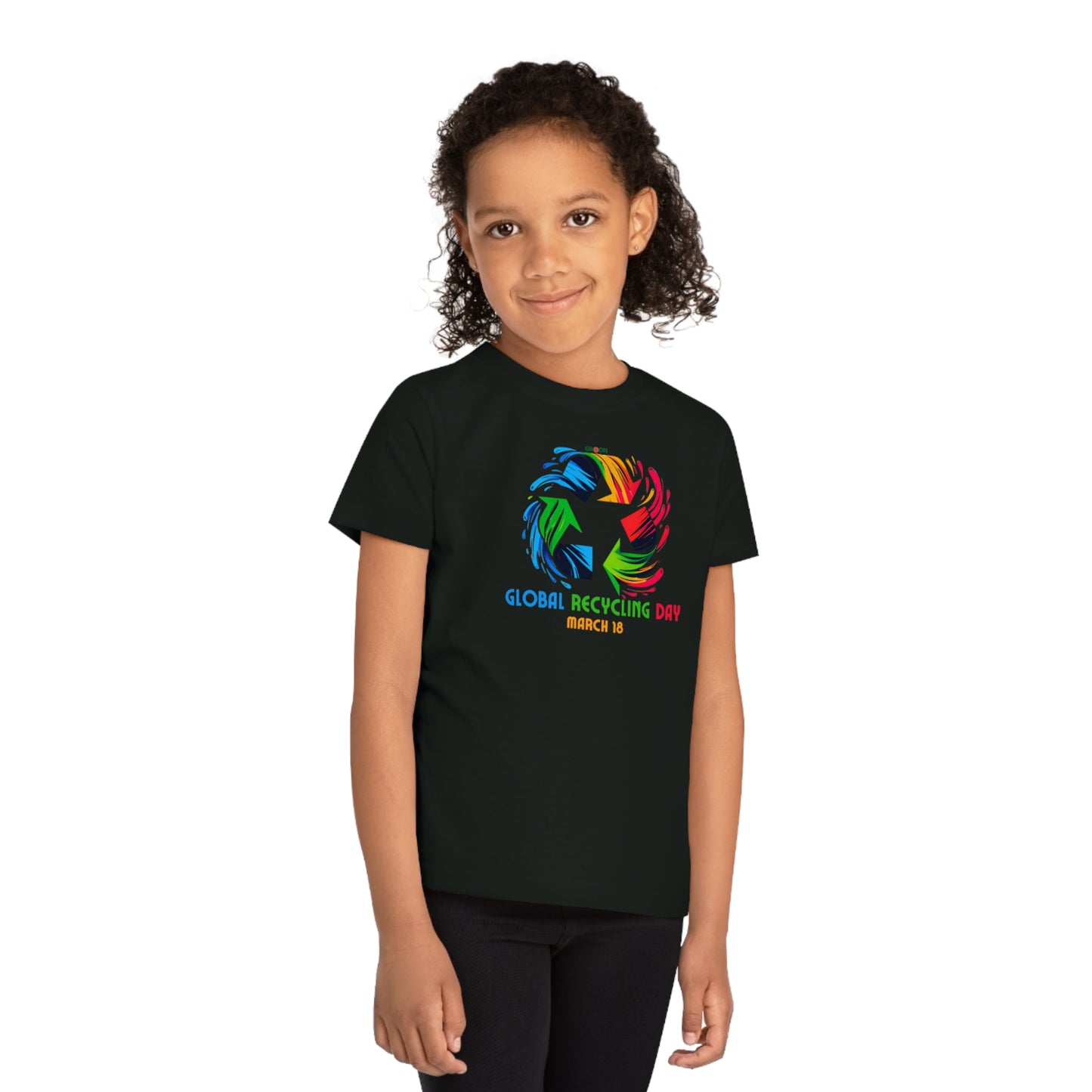 Global Recycling Day, Child wearing a GR@ON Kids T-Shirt made from organic cotton, featuring a fun and colorful design. GR@ON Kids T-Shirts: Sustainable style, fun designs.