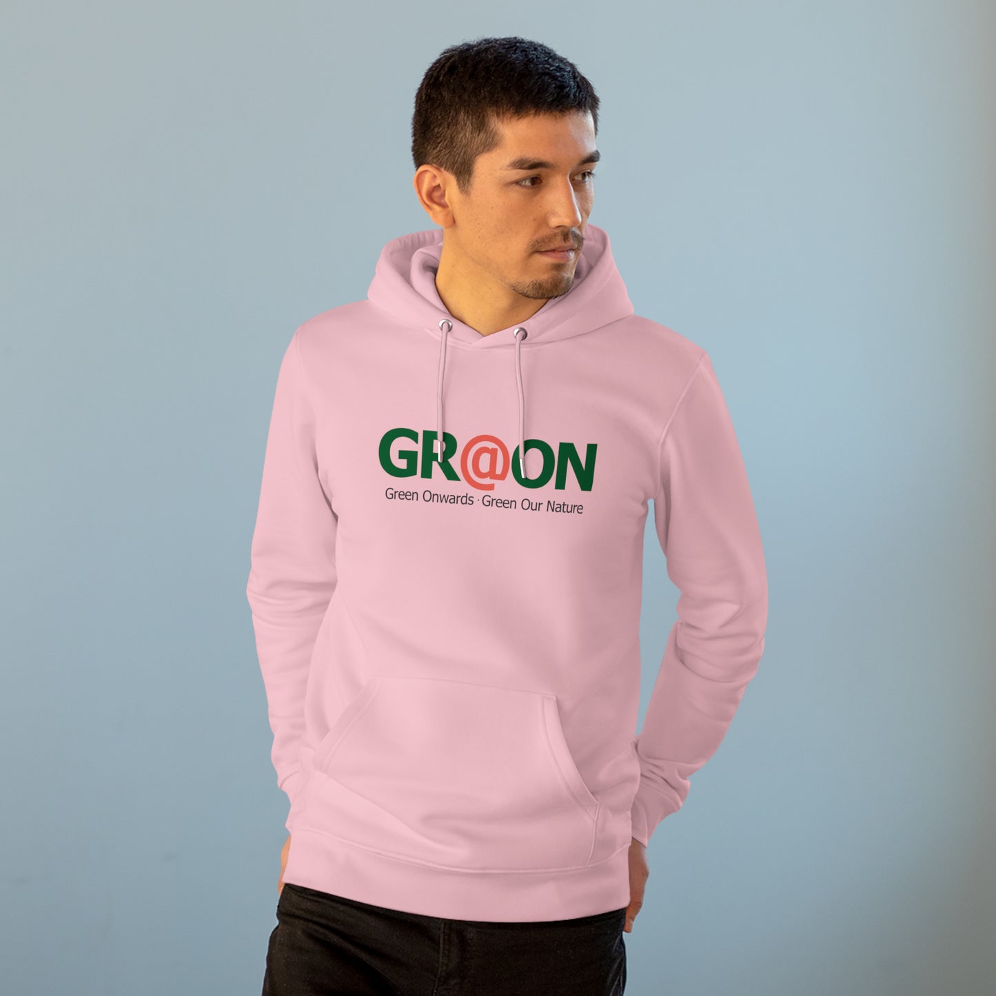 Model wearing a GR@ON Hoodie made from organic cotton, featuring a stylish and sustainable design. GR@ON Hoodies: Sustainable warmth, stylish comfort.