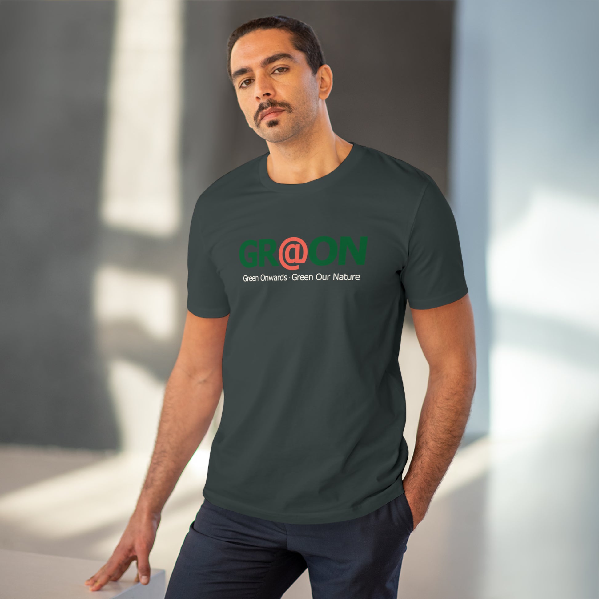 Model wearing a GR@ON T-Shirt made from organic cotton, featuring a stylish and sustainable design. GR@ON T-Shirts: Sustainable style, everyday comfort.