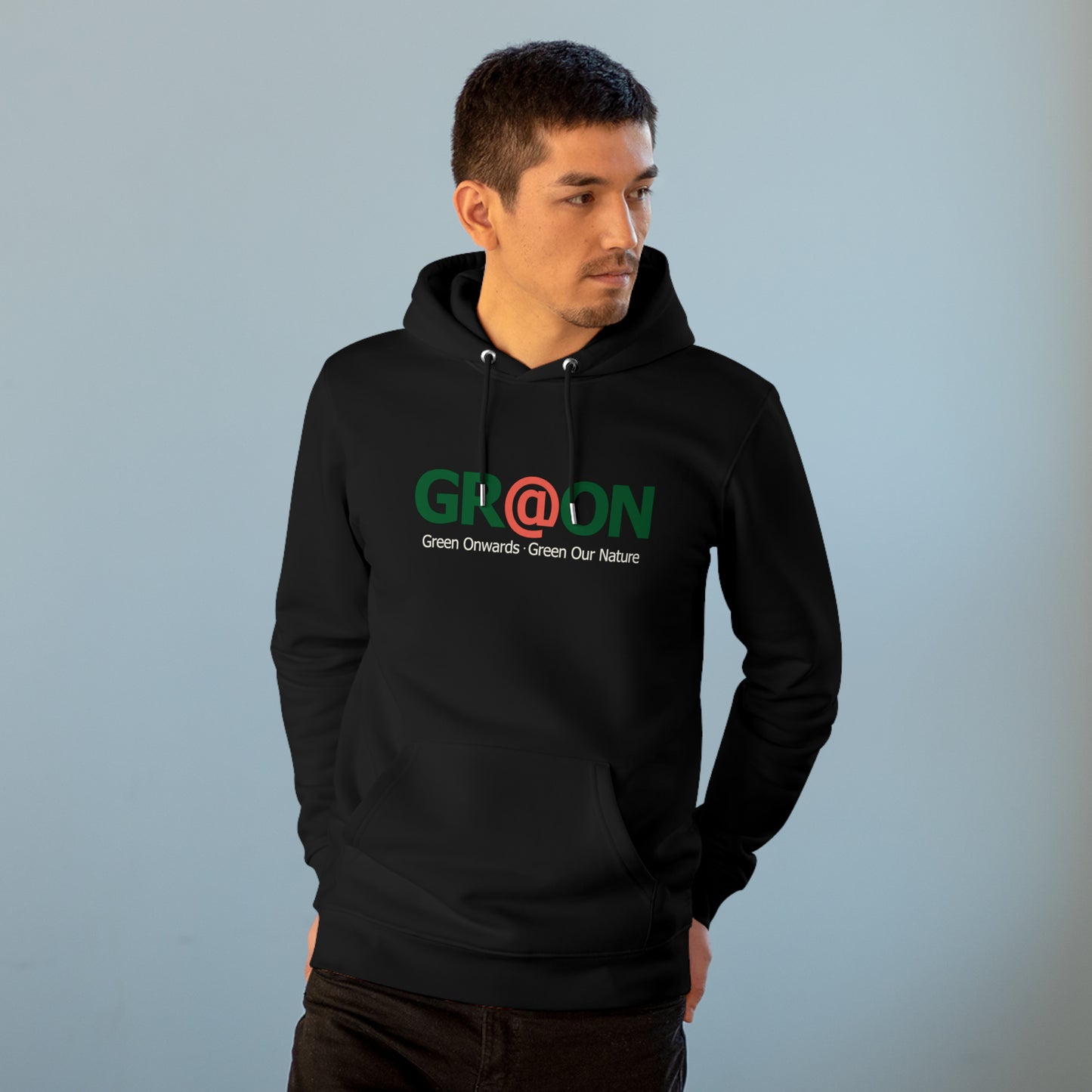 Model wearing a GR@ON Hoodie made from organic cotton, featuring a stylish and sustainable design. GR@ON Hoodies: Sustainable warmth, stylish comfort.