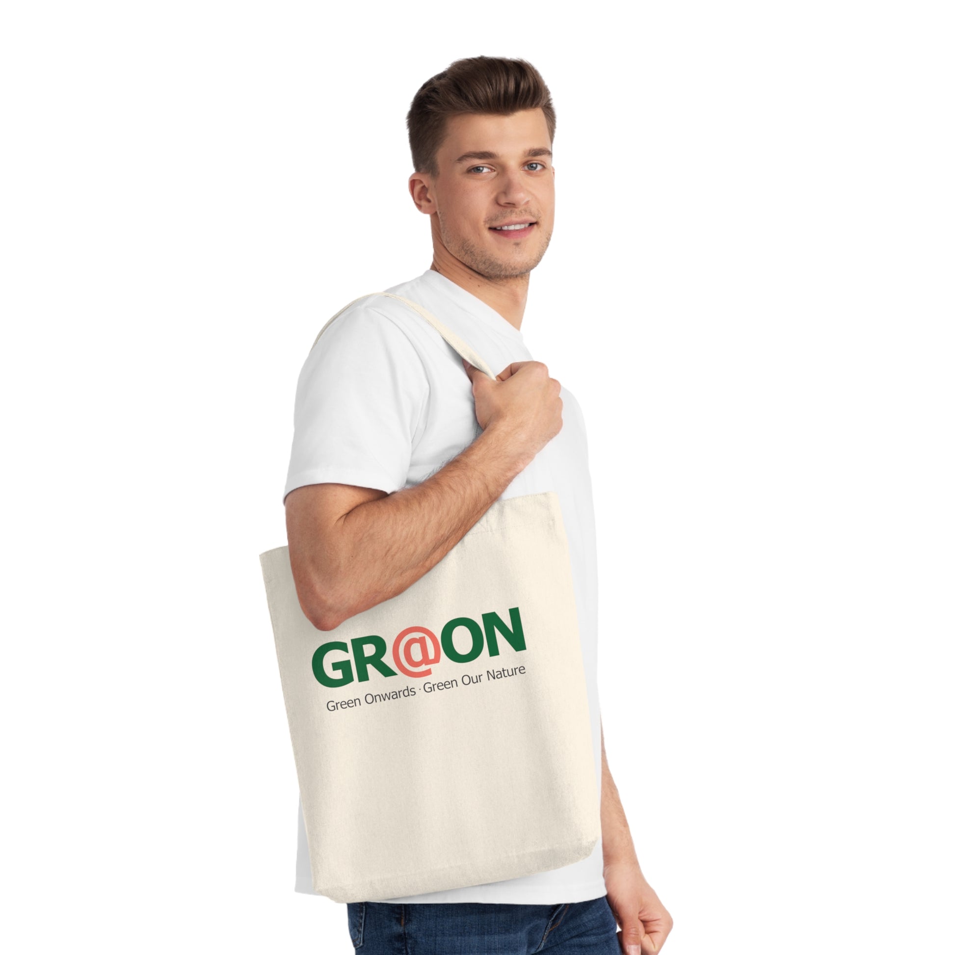 Person carrying a GR@ON Tote Bag made from organic cotton, filled with everyday essentials. GR@ON Tote Bags: Sustainable style, everyday essentials.