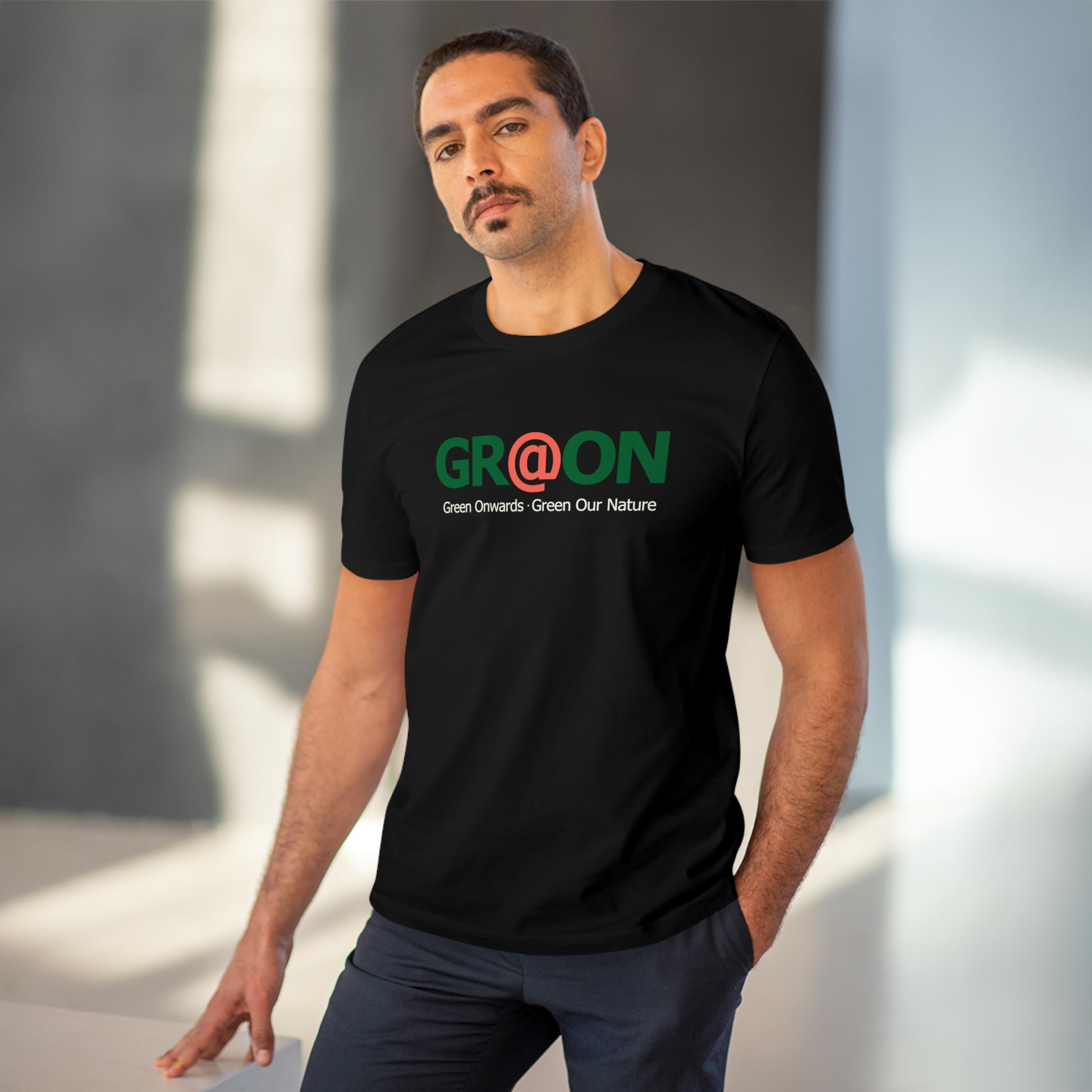 Model wearing a GR@ON T-Shirt made from organic cotton, featuring a stylish and sustainable design. GR@ON T-Shirts: Sustainable style, everyday comfort.