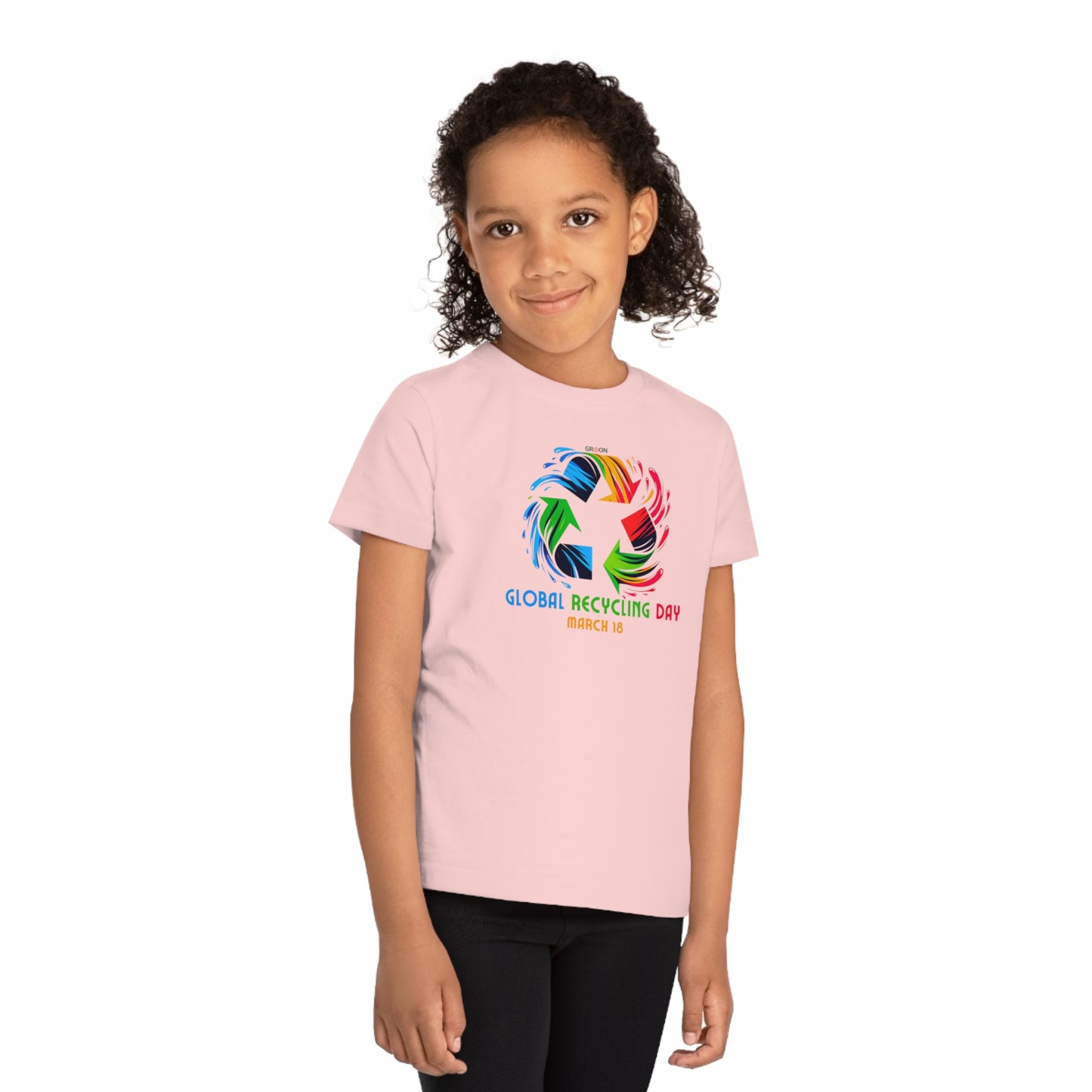 Global Recycling Day, Child wearing a GR@ON Kids T-Shirt made from organic cotton, featuring a fun and colorful design. GR@ON Kids T-Shirts: Sustainable style, fun designs.