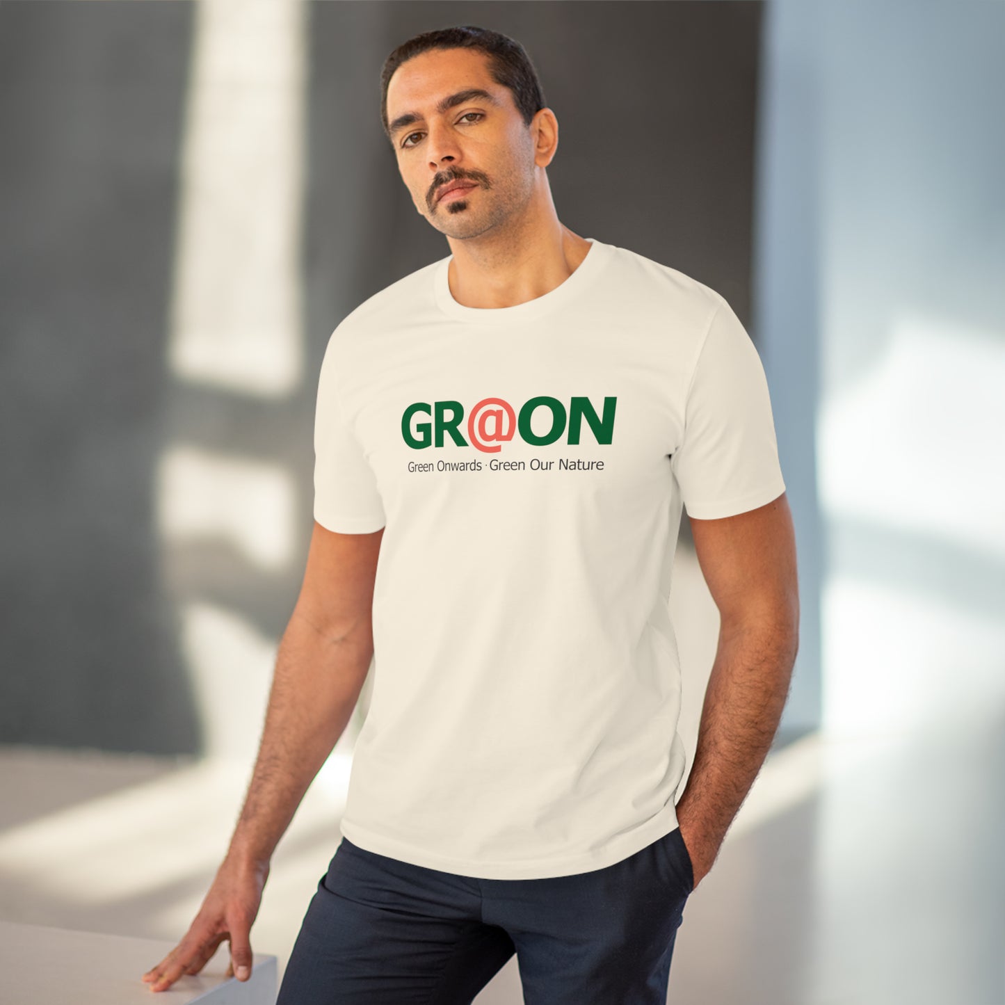 Model wearing a GR@ON T-Shirt made from organic cotton, featuring a stylish and sustainable design. GR@ON T-Shirts: Sustainable style, everyday comfort.