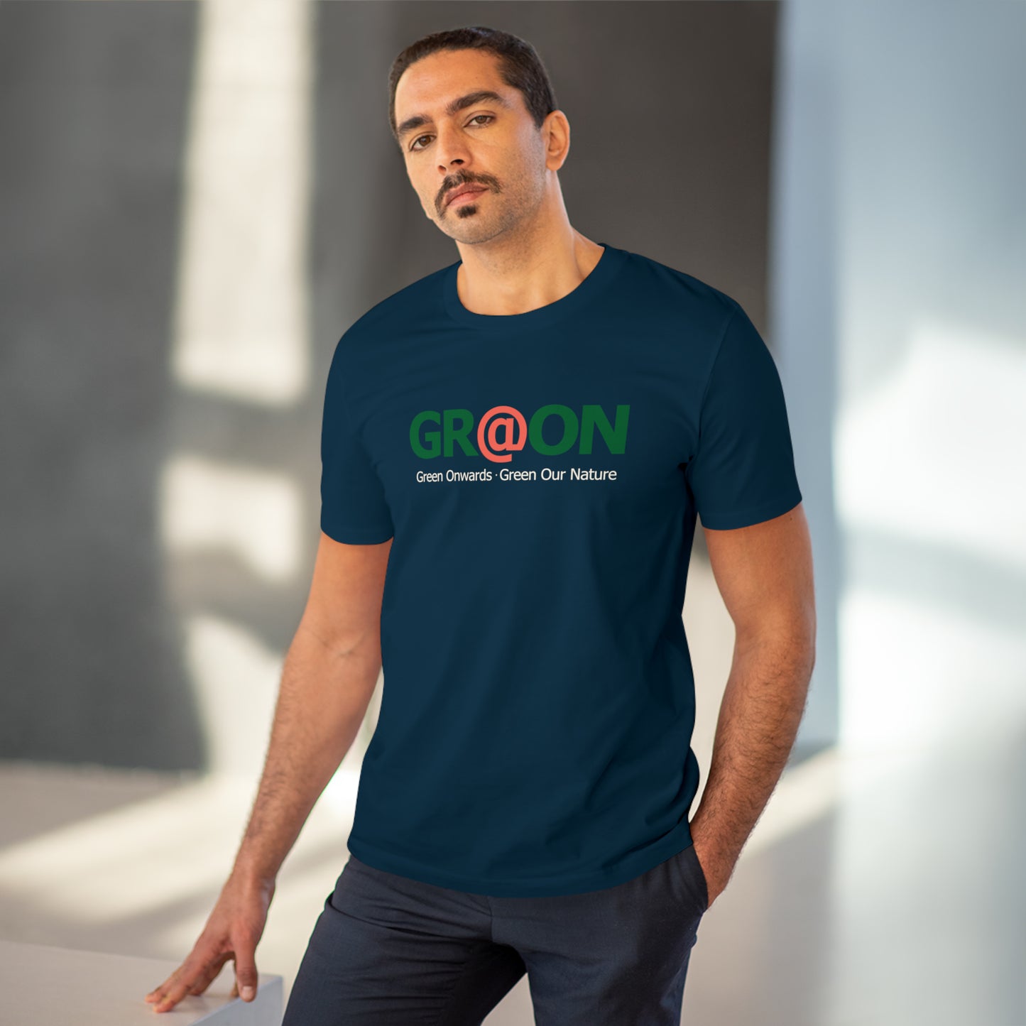 Model wearing a GR@ON T-Shirt made from organic cotton, featuring a stylish and sustainable design. GR@ON T-Shirts: Sustainable style, everyday comfort.