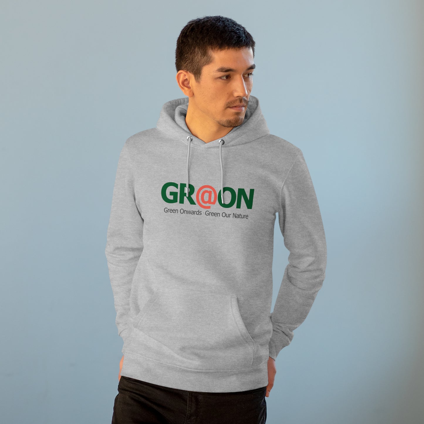 Model wearing a GR@ON Hoodie made from organic cotton, featuring a stylish and sustainable design. GR@ON Hoodies: Sustainable warmth, stylish comfort.