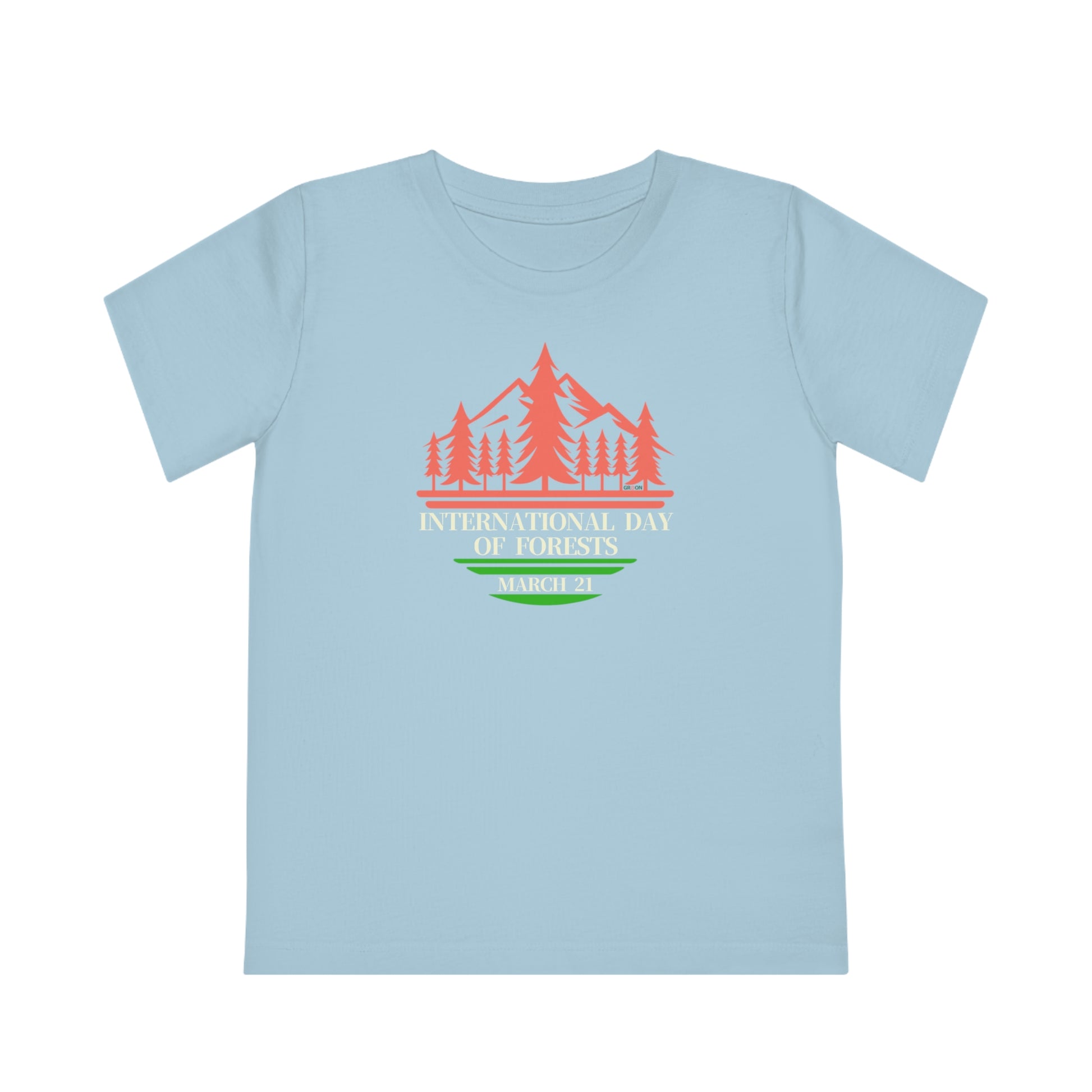 International Day of Forests, Child wearing a GR@ON Kids T-Shirt made from organic cotton, featuring a fun and colorful design. GR@ON Kids T-Shirts: Sustainable style, fun designs.