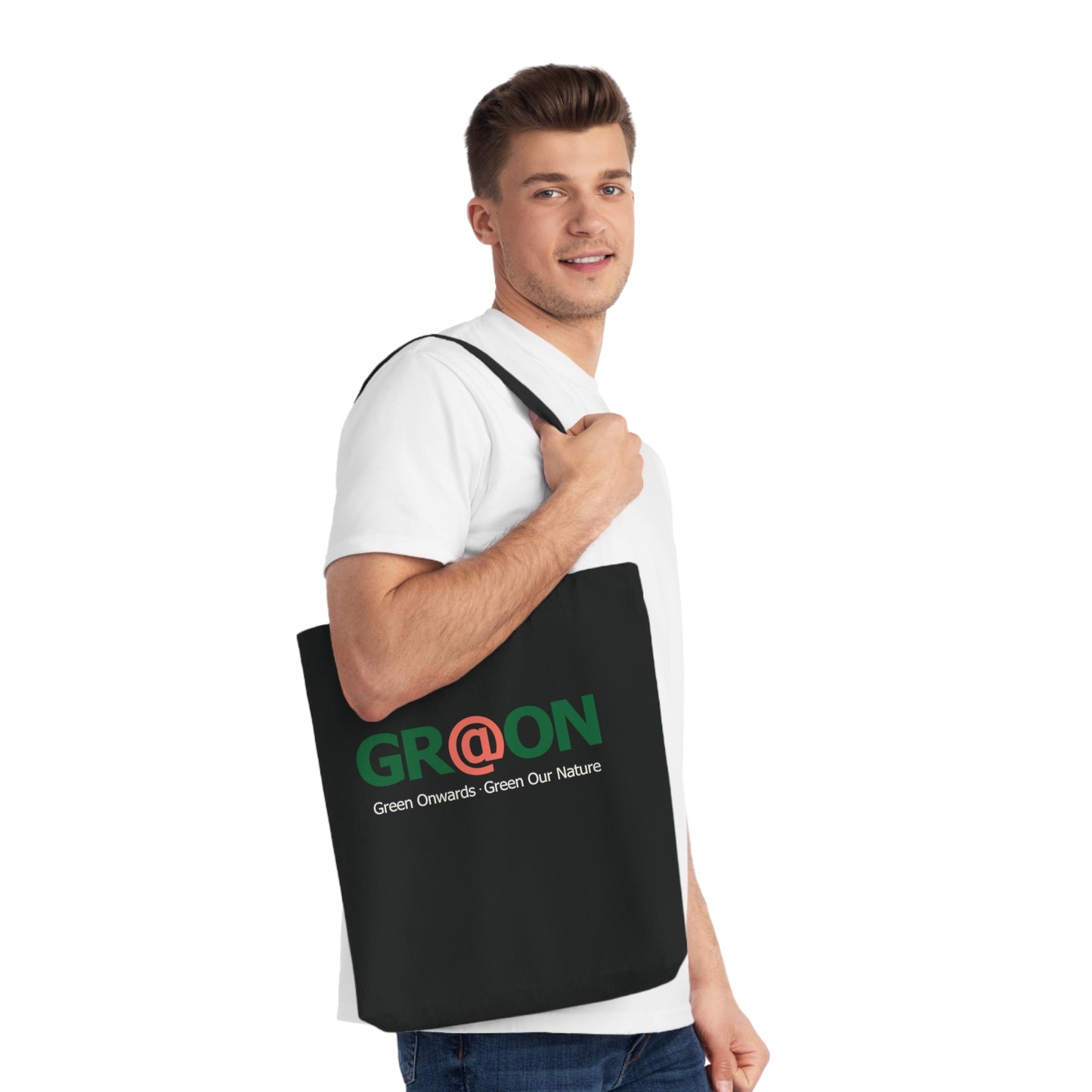 Person carrying a GR@ON Tote Bag made from organic cotton, filled with everyday essentials. GR@ON Tote Bags: Sustainable style, everyday essentials.