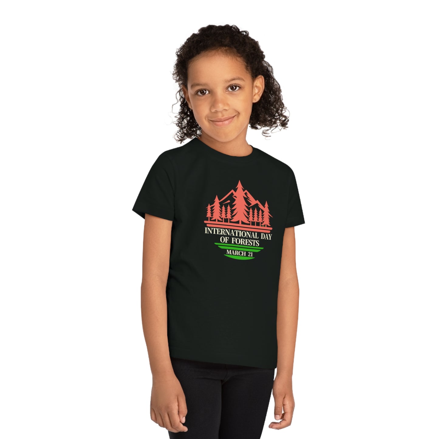 International Day of Forests, Child wearing a GR@ON Kids T-Shirt made from organic cotton, featuring a fun and colorful design. GR@ON Kids T-Shirts: Sustainable style, fun designs.