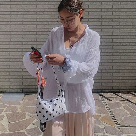 A selection of Dongdaemum Women’s Shirts & Tops, showcasing the best of Korean fashion.