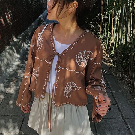 A selection of Dongdaemum Women’s Shirts & Tops, showcasing the best of Korean fashion.