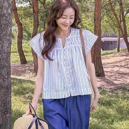 A selection of Dongdaemum Women’s Shirts & Tops, showcasing the best of Korean fashion.