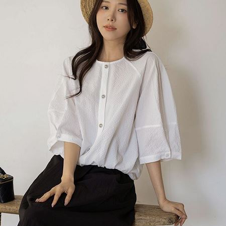 A selection of Dongdaemum Women’s Shirts & Tops, showcasing the best of Korean fashion.