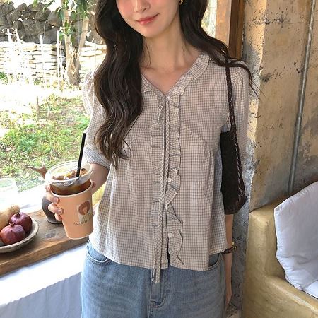 A selection of Dongdaemum Women’s Shirts & Tops, showcasing the best of Korean fashion.