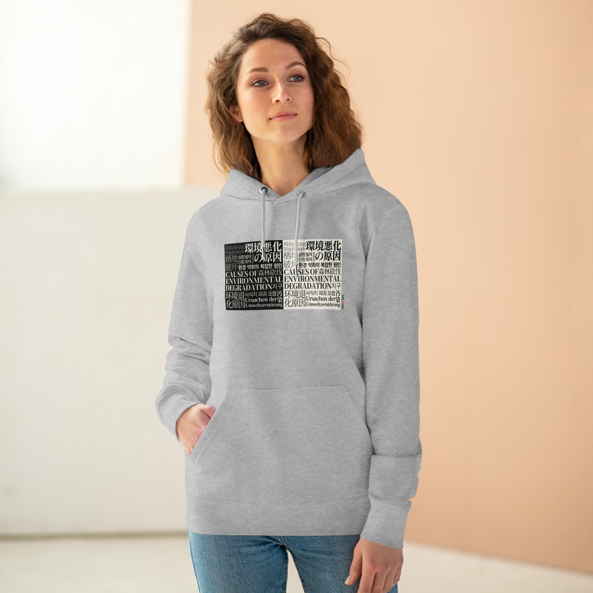 Model wearing a GR@ON Hoodie made from organic cotton, featuring a stylish and sustainable design. GR@ON Hoodies: Sustainable warmth, stylish comfort.