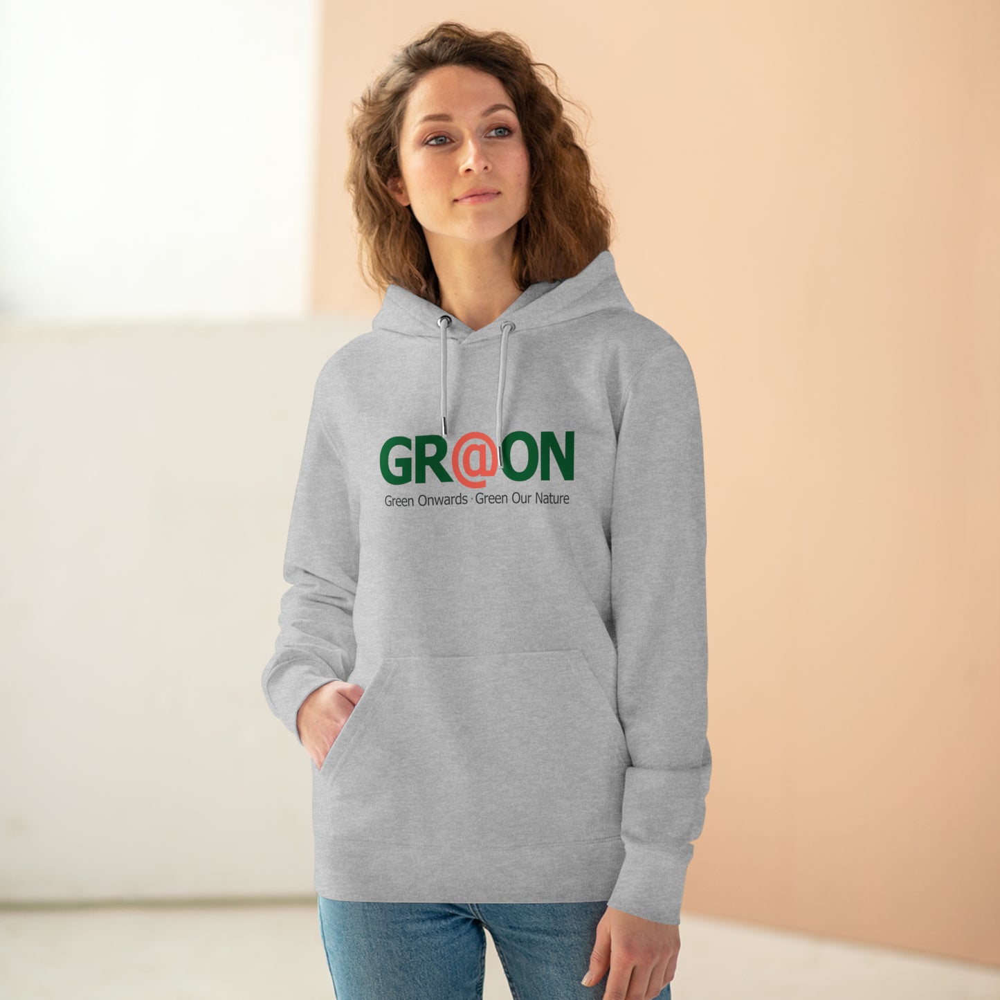 Model wearing a GR@ON Hoodie made from organic cotton, featuring a stylish and sustainable design. GR@ON Hoodies: Sustainable warmth, stylish comfort.