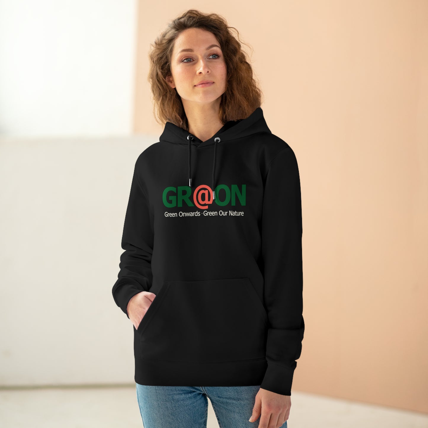 Model wearing a GR@ON Hoodie made from organic cotton, featuring a stylish and sustainable design. GR@ON Hoodies: Sustainable warmth, stylish comfort.