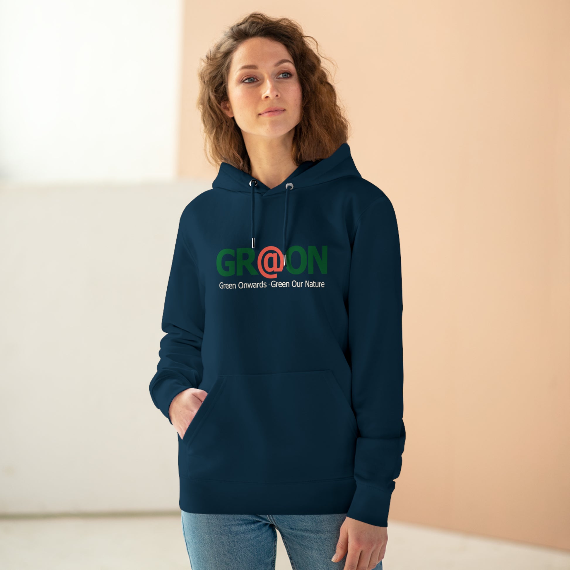 Model wearing a GR@ON Hoodie made from organic cotton, featuring a stylish and sustainable design. GR@ON Hoodies: Sustainable warmth, stylish comfort.