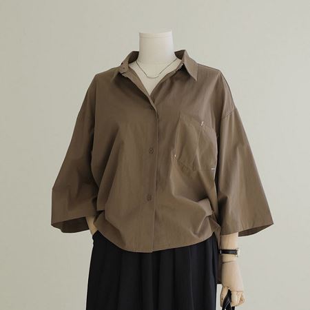 Dongdaemum Women’s Shirts, Tops & T-Shirts, a testament to the elegance and quality of wholesale Korean fashion.